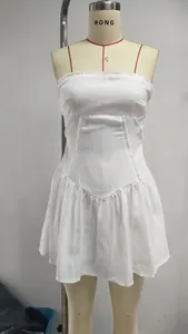 Front view detail of a white strapless pleated mini dress displayed on a mannequin