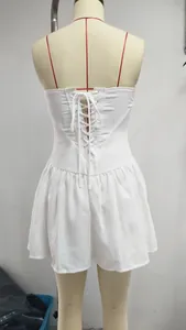 Detailed back view of a white tube top backless pleated mini dress with lace-up corset
