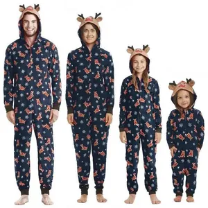 Matching family Christmas hooded onesies with reindeer print and antler hood detail.