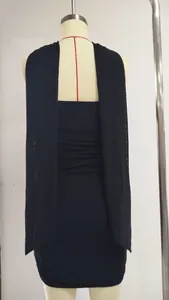 Back view of a black slim-fit tube top mini dress with elegant flowing streamers