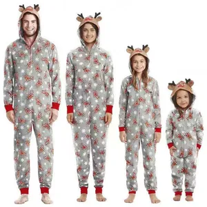 Matching Christmas family pajamas featuring festive reindeer hooded onesie design