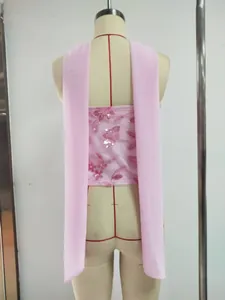 Detail view of a pink sequined tube top with long chiffon scarf straps on a mannequin.