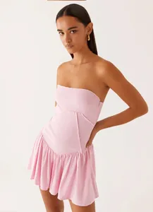 Detailed view of a pink strapless backless pleated mini dress for trendy summer fashion