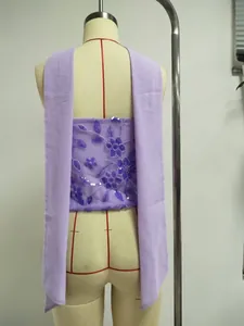 Back view detail of purple strapless dress featuring intricate floral sequin embroidery