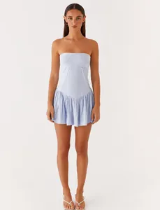 Front view of light blue strapless tube mini dress with ruffled hem on female model