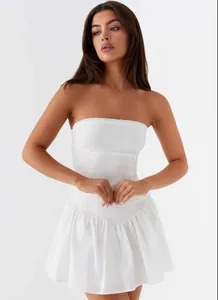 Front view of a white strapless mini dress with corset bodice and pleated skirt