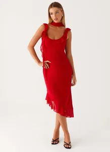 Elegant red midi dress with ruffled hem, rosette shoulder detail and matching red scarf
