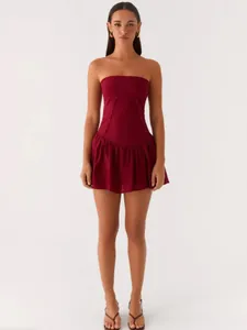 Elegant strapless backless burgundy pleated mini dress for women on white background