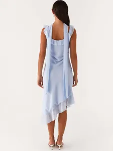 Elegant light blue sleeveless dress with ruffled wood ear trim and asymmetrical hem