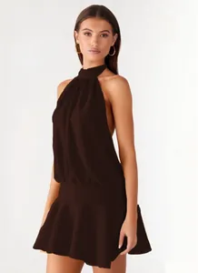Full view of a sexy dark brown halter neck mini dress featuring an open back design.