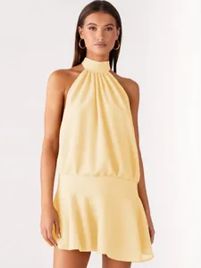 Elegant pale yellow halter neck sleeveless mini dress for women's summer fashion.