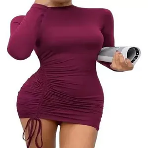 Detail view of ruched drawstring side on burgundy long sleeve high neck mini dress.