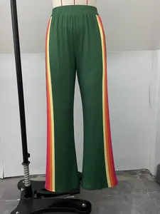 Green women's casual trousers with vibrant rainbow side stripes shown on a mannequin