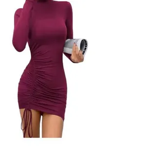 Detailed view of a purple turtleneck long sleeve ruched dress featuring drawstring side.
