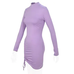 Side view showing the intricate drawstring ruched detail on this purple high neck dress.