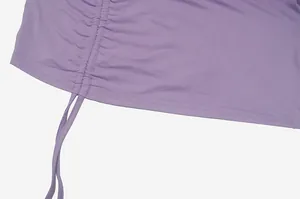 Detailed view of the purple dress showing the intricate ruched drawstring hem design