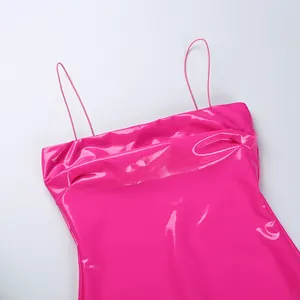 Close-up of hot pink shiny patent leather cami dress neckline with thin straps detail