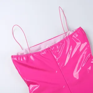 Detail of sexy pink PU leather mini dress with spaghetti straps and back zipper.