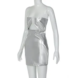 Detail view of metallic silver PU leather fabric and the unique front cutout design of the dress
