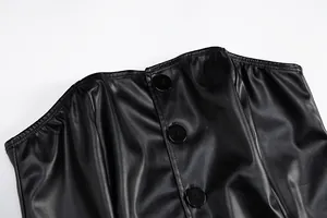 Detail of the black PU leather strapless top showing the button-down front texture
