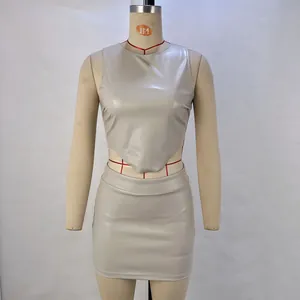 Detail view of grey PU leather two-piece set featuring sleeveless top and mini skirt