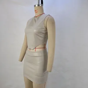 Side view of chic grey PU leather two-piece set featuring sleeveless top and mini skirt