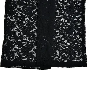 Detailed close-up showing the intricate floral lace pattern of these black pants