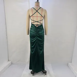 Back view detail of sexy dark green satin evening gown with cross straps and ruched design
