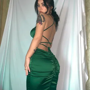 Sexy backless green satin maxi dress with cross-strap detail and ruched back design.