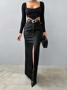 Elegant high-waisted black PU leather maxi skirt featuring a chic front slit for women.