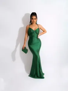 Elegant emerald green satin mermaid evening gown with slim fit silhouette and cami straps