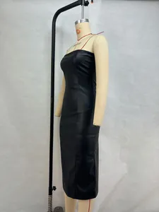 Detailed side view of a slim-fit black PU leather strapless midi dress on a mannequin