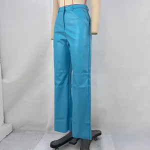 Detailed side view of these bright blue PU leather straight-leg pants on a mannequin