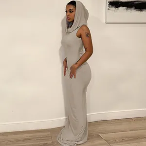Close-up of a sleeveless hooded maxi dress in grey, showing the tight fit and smooth fabric texture.