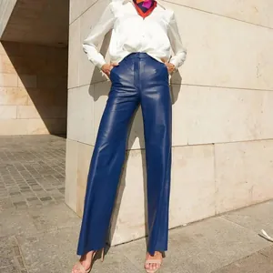 Full view of blue PU leather straight-leg high-waisted trousers styled with white shirt
