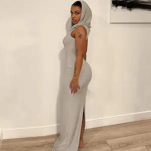 Detail view of a sleek gray hooded sleeveless bodycon maxi dress showing side silhouette