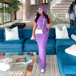 Stylish women's purple hooded bodycon maxi dress presented in a modern living room setting