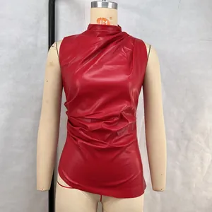 Close-up of sleeveless red faux leather vest with draped design and high neck