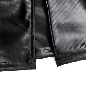 Detail view of the hem and professional slit stitching on a black PU leather dress.