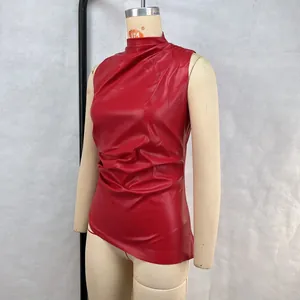 Detailed view of red sleeveless leather top with stand collar and gathered waist