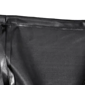 Close-up of black PU leather texture and neat stitching on a sexy nightclub dress.