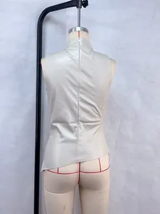 Back view of beige sleeveless leather vest with stand collar and asymmetrical hem