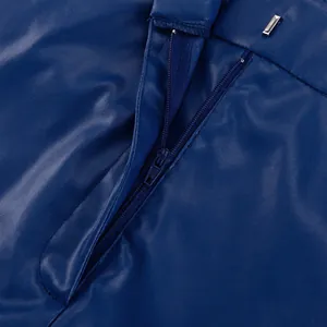 Close-up detail of the metal hook closure and hidden zipper on navy blue PU leather trousers