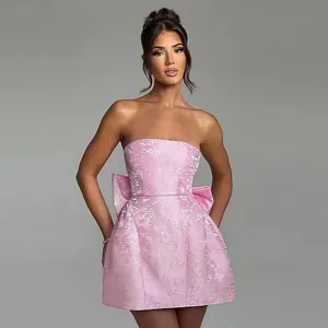 Elegant pink strapless jacquard mini dress featuring a large decorative bow for women