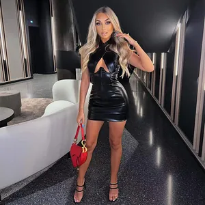 Detail view of a sexy black halter neck PU leather mini dress with front cutout