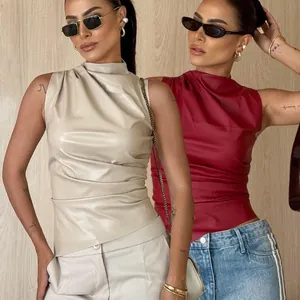 Stylish sleeveless faux leather top with high neck and irregular draped hemline