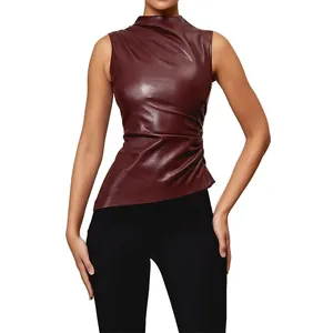 Sleeveless burgundy faux leather top with a mock neck and stylish asymmetrical hemline