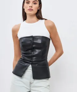 Detail view of a black PU leather strapless corset top with button-down front and peplum hem.