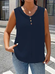 Close-up of navy blue V-neck sleeveless top with textured fabric and button detail