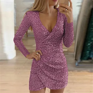 Detailed view of a glittering magenta sequin mini dress featuring a sexy deep V-neckline